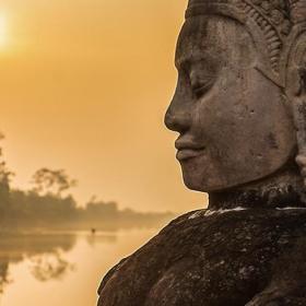 Buddha is shown over a body of water in Angkor Wat, where Projects Abroad volunteers visit and educate themselves on Khmer History