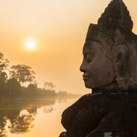 Buddha is shown over a body of water in Angkor Wat, where Projects Abroad volunteers visit and educate themselves on Khmer history.