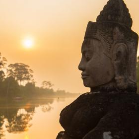 Buddha is shown over a body of water in Angkor Wat, where Projects Abroad volunteers visit and educate themselves on Khmer history.