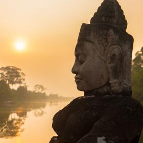 Buddha is shown over a body of water in Angkor Wat, where Projects Abroad volunteers visit and educate themselves on Khmer history.
