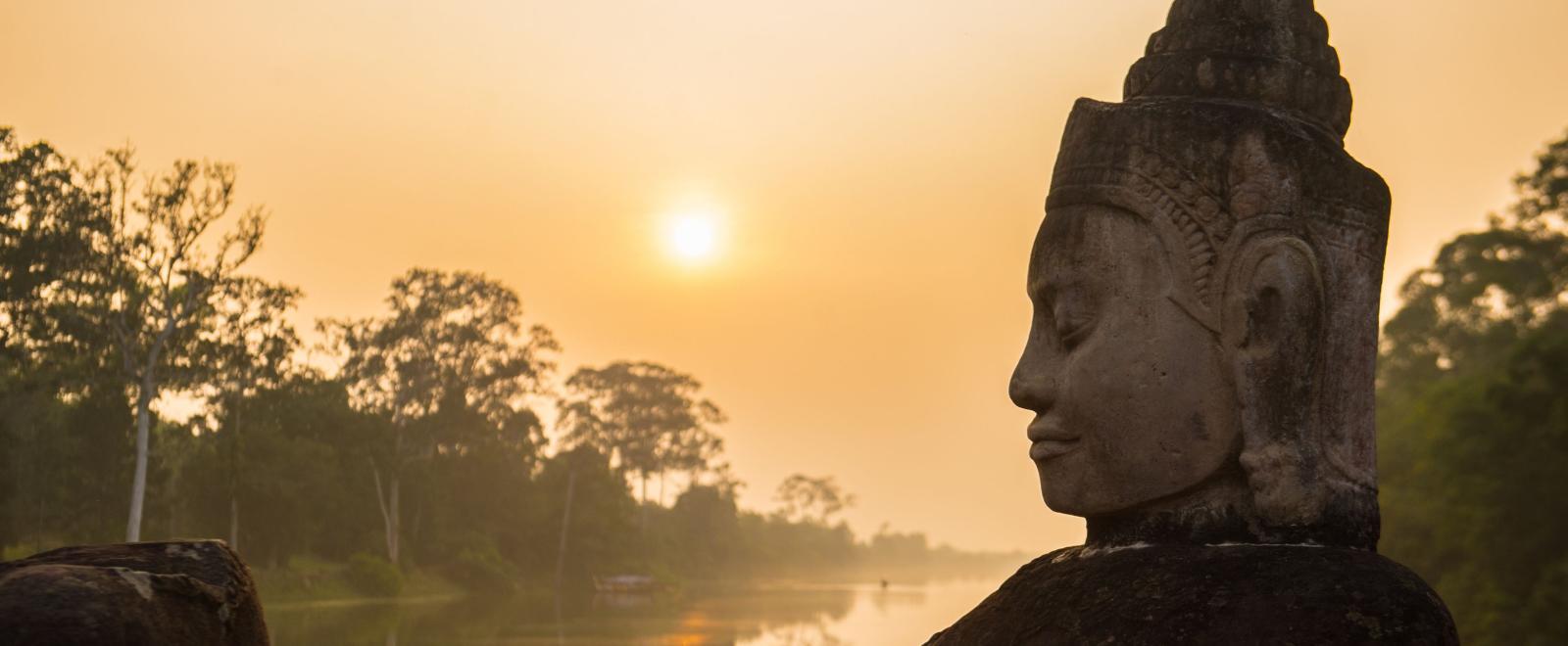 Buddha is shown over a body of water in Angkor Wat, where Projects Abroad volunteers visit and educate themselves on Khmer history.