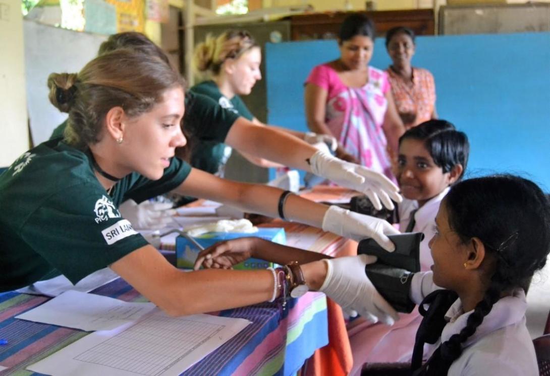 Medical High School volunteers conducting a health check