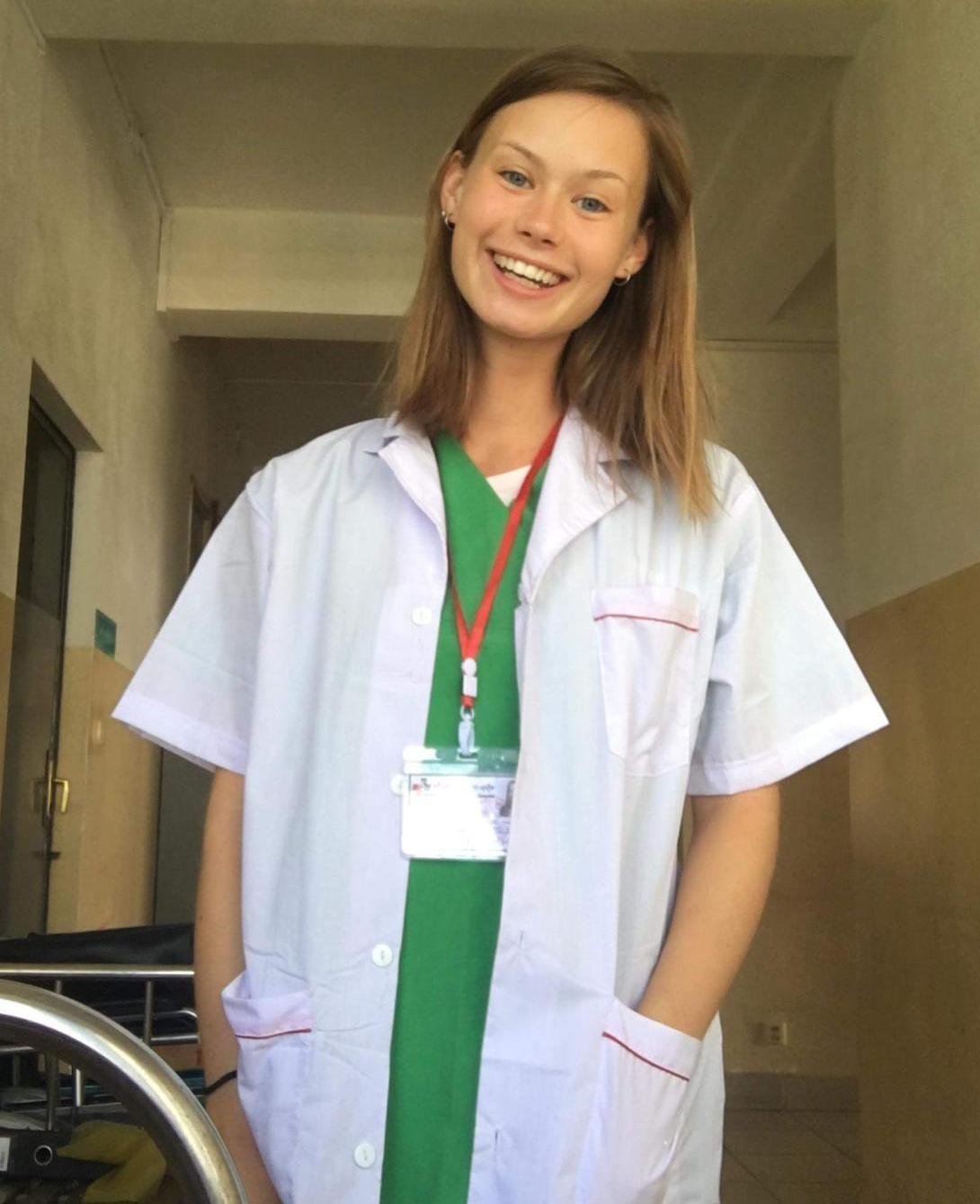 A medical volunteer smiles during her international internship in Cambodia