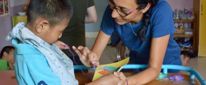 An Occupational Therapy intern gains work experience by helping treat a disabled child in Cambodia.