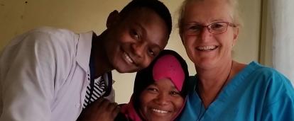 Australian intern on a nursing internship in Tanzania with Proejcts Abroad takes a photo with colleagues during her work experience.
