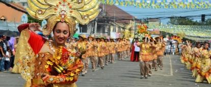 Projects Abroad volunteer work in the Philippines is ongoing as the locals celebrate a festival in the streets.