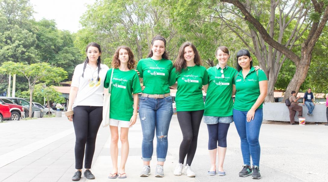 A group volunteering overseas together get ready to take part in a community outreach. 