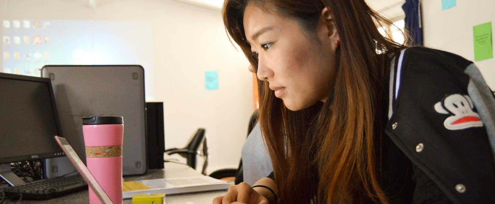 A student prepares for her volunteer trip by browsing through our website to find out how our projects work.