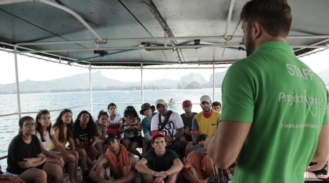 Diving volunteers are briefed by staff before a dive