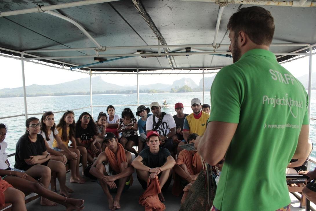 Diving volunteers are briefed by staff before a dive