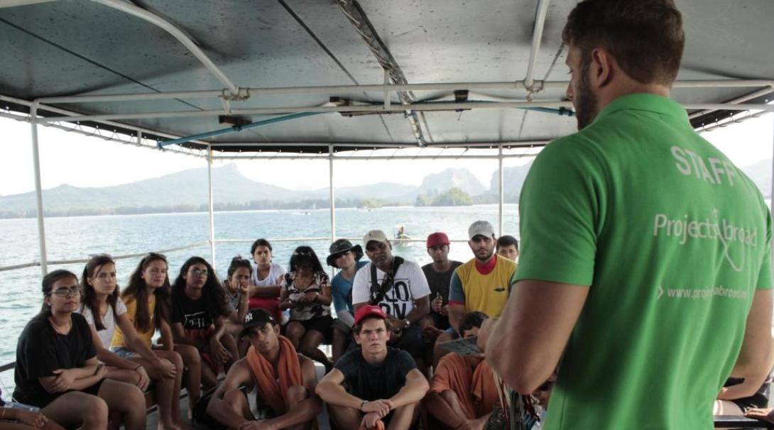Diving volunteers are briefed by staff before a dive