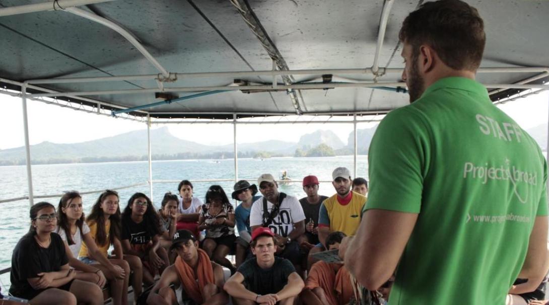 Diving volunteers are briefed by staff before a dive