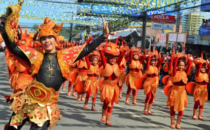 A volunteer studying English in the Philippines attends a local festival to learn about the culture.