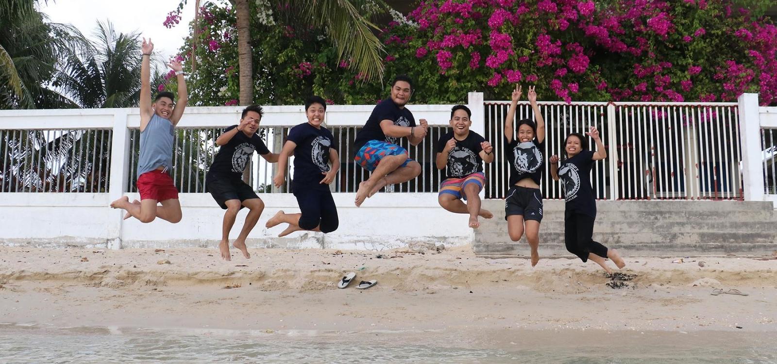 Projects Abroad volunteers having fun on a beach in the Philippines