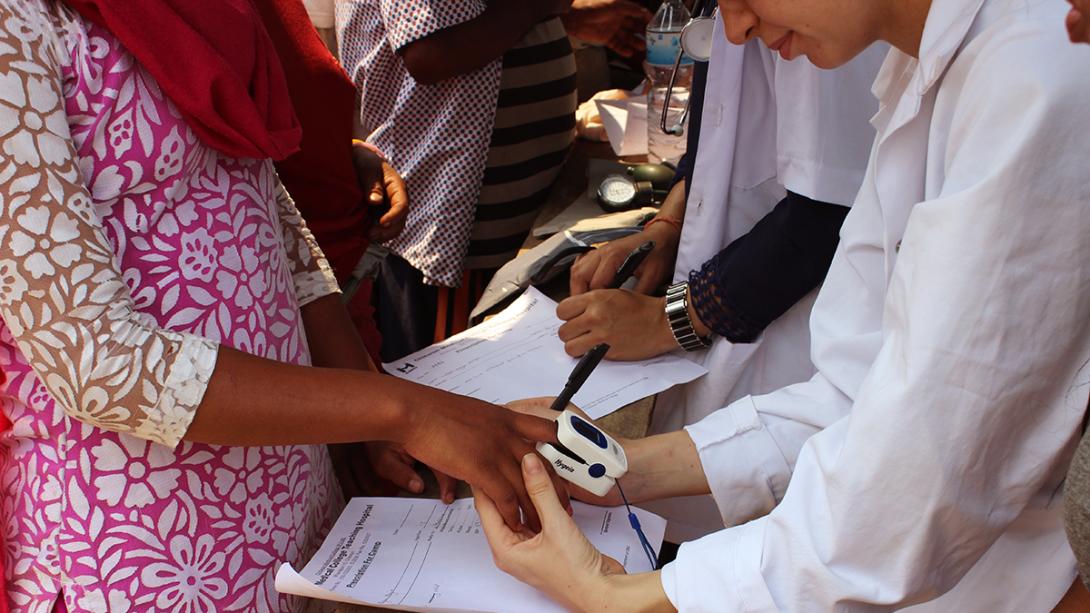Medical interns abroad check people’s blood pressure during an outreach in Nepal