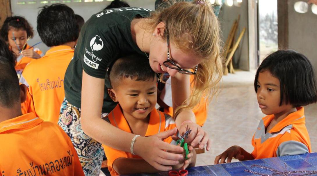 Care volunteers looking after school children in Thailand