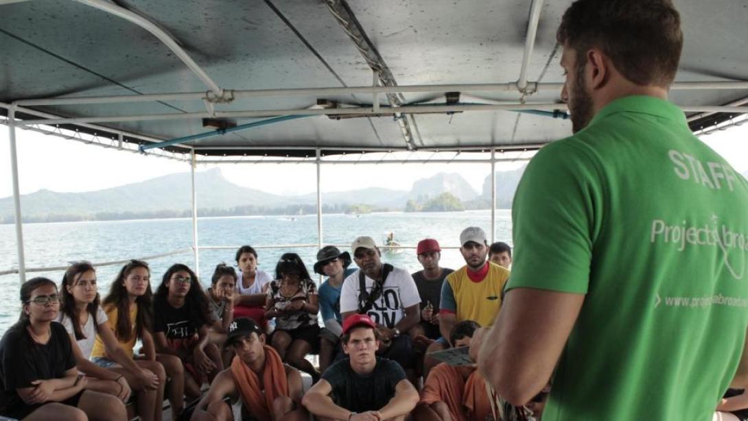 Diving volunteers are briefed by staff before a dive