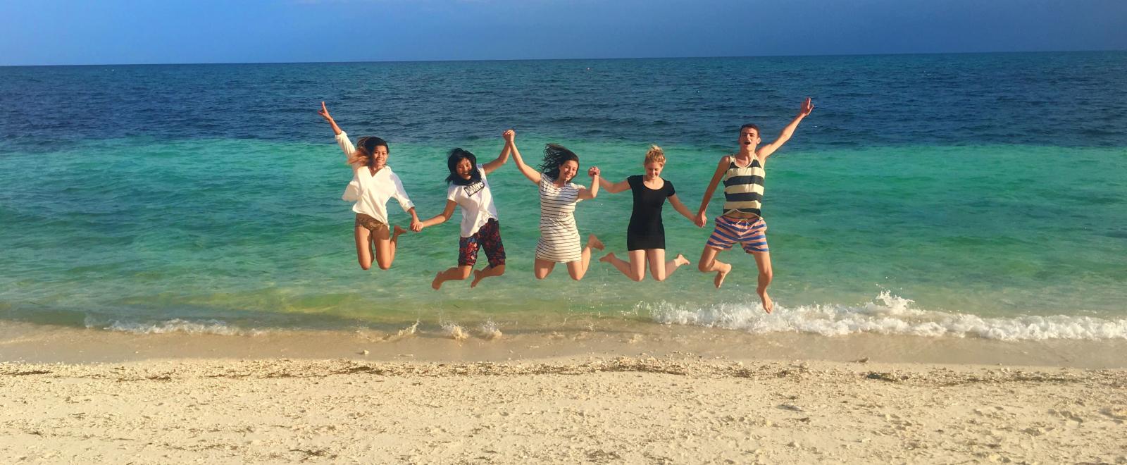 Projects Abroad volunteers having fun on a beach in the Philippines.